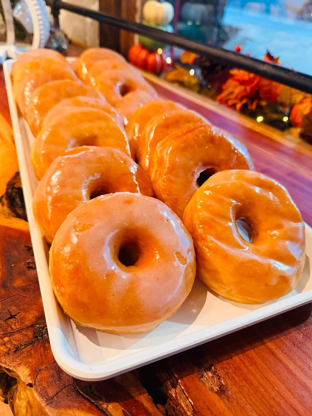 A tray of glazed donuts